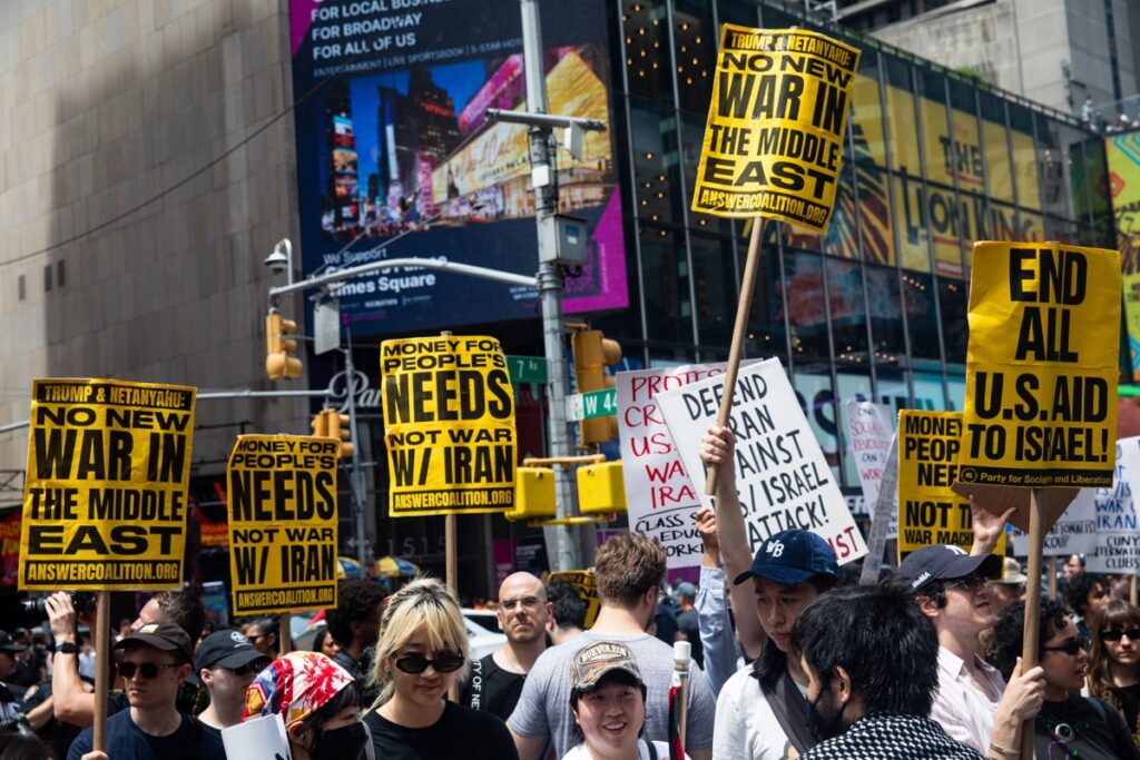 People in New York City's Times Square react to US air strikes on Iran