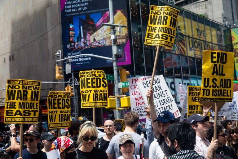 People in New York City's Times Square react to US air strikes on Iran